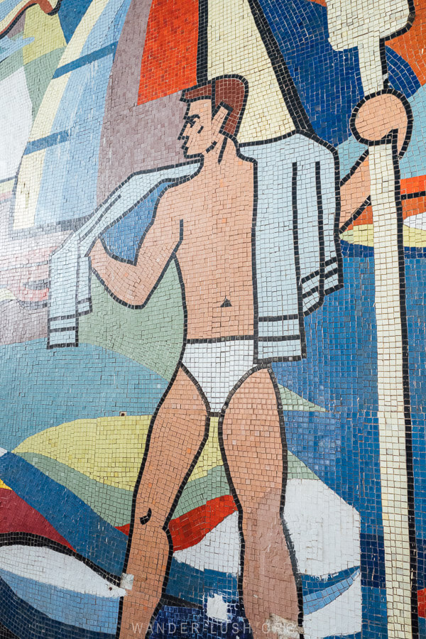 A mosaic of a man with a towel wrapped around his shoulders in Rustavi.