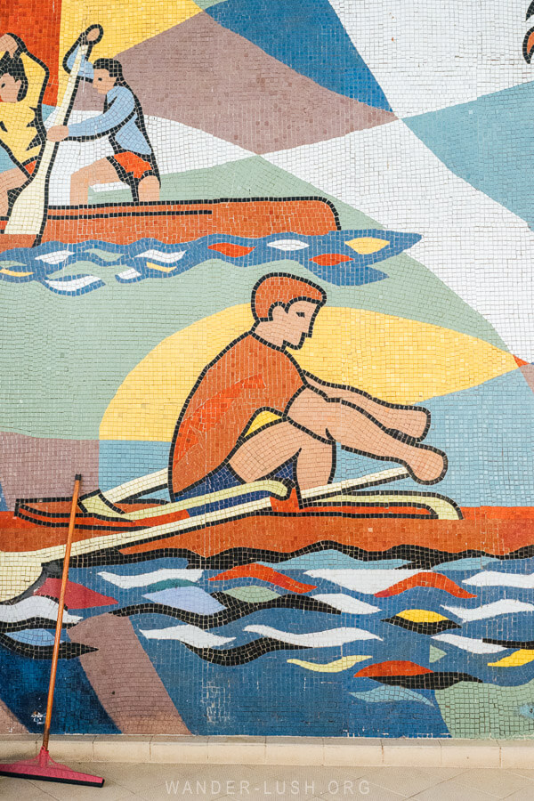 A mosaic of a man rowing a kayak in Rustavi.