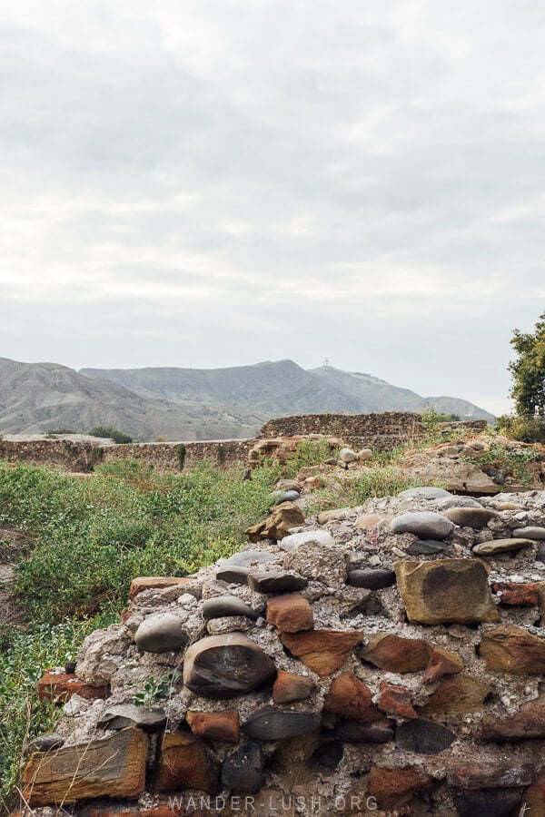 An old stone wall inside the Rustavi Fortress complex.