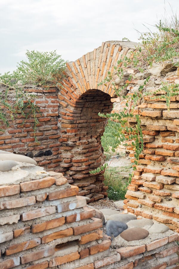 A reconstructed brick arch inside Rustavi Fortress, an ancient fortification in Georgia.