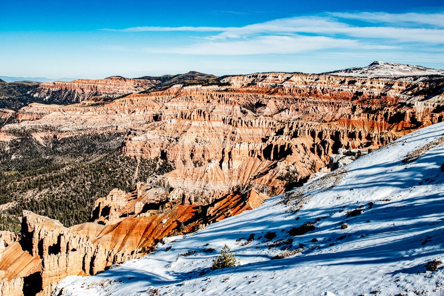 Snow and red rock formations in Utah.