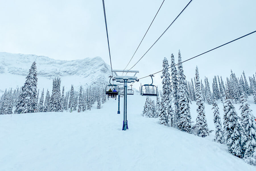 A chairlift ferries skiers through the trees at the Fernie Ski Resort in British Colombia.