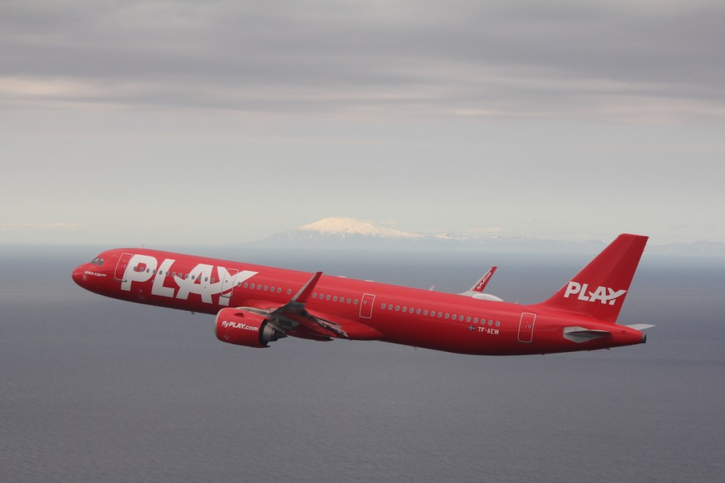 PLAY plane in flight