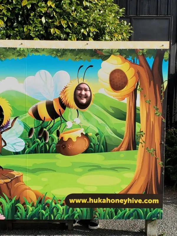 Riana in a bee cut out at Huka Honey Hive in Taupo, New Zealand