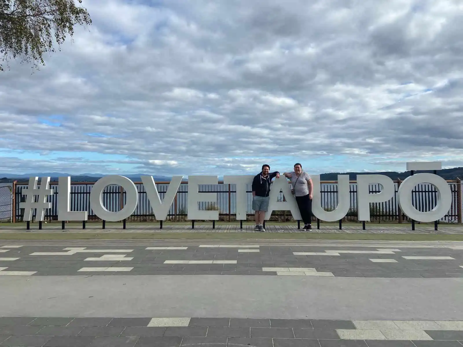 Colin and Riana photo at the #LoveTaupo sign