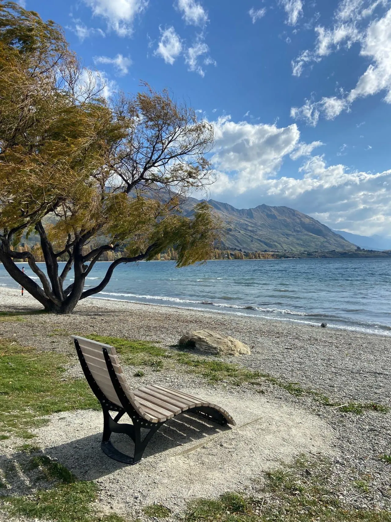 Lounge chair on the shore of Lake Wanaka, New Zealand