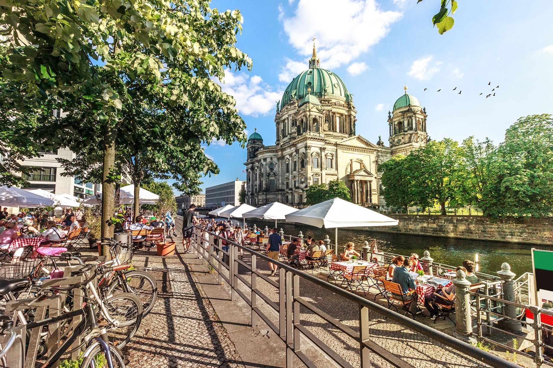 View of Spree River and Berliner Dom, Berlin, Germany.
Image taken outdoors, daylight, in summer.
Incidental people in the image.