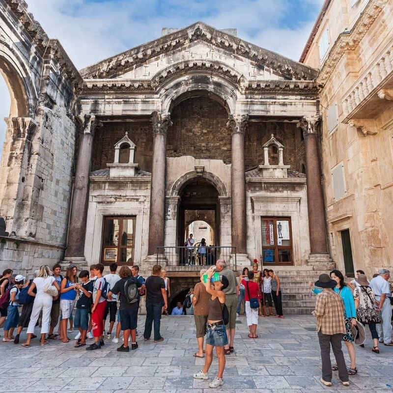 Tourists Walking The Square Inside Diocletian's Palace In Split, Croatia