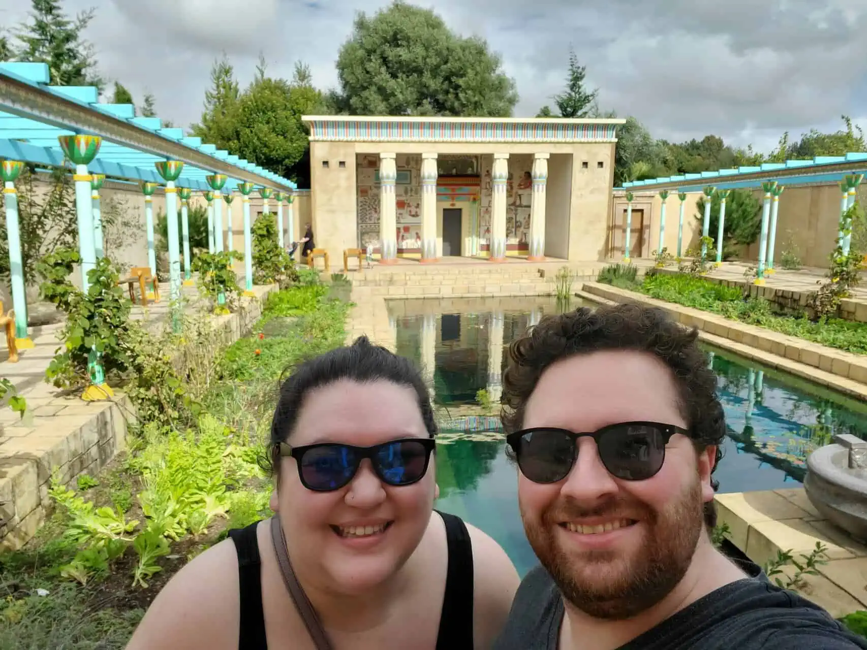 Riana and Colin taking a selfie in front of the Egyptian Garden in Hamilton Gardens, New Zealand