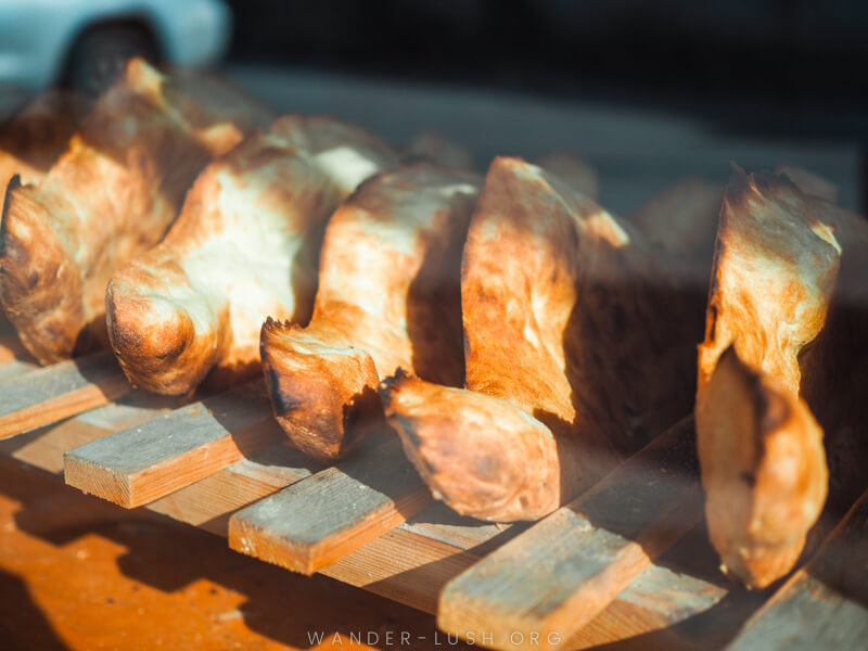 Pieces of Georgian bread on a wooden rack.