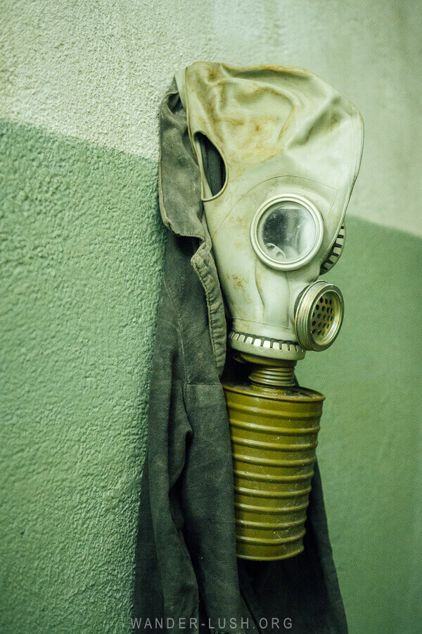 A gas mask hangs on the wall inside a bunker in Tbilisi, Georgia.