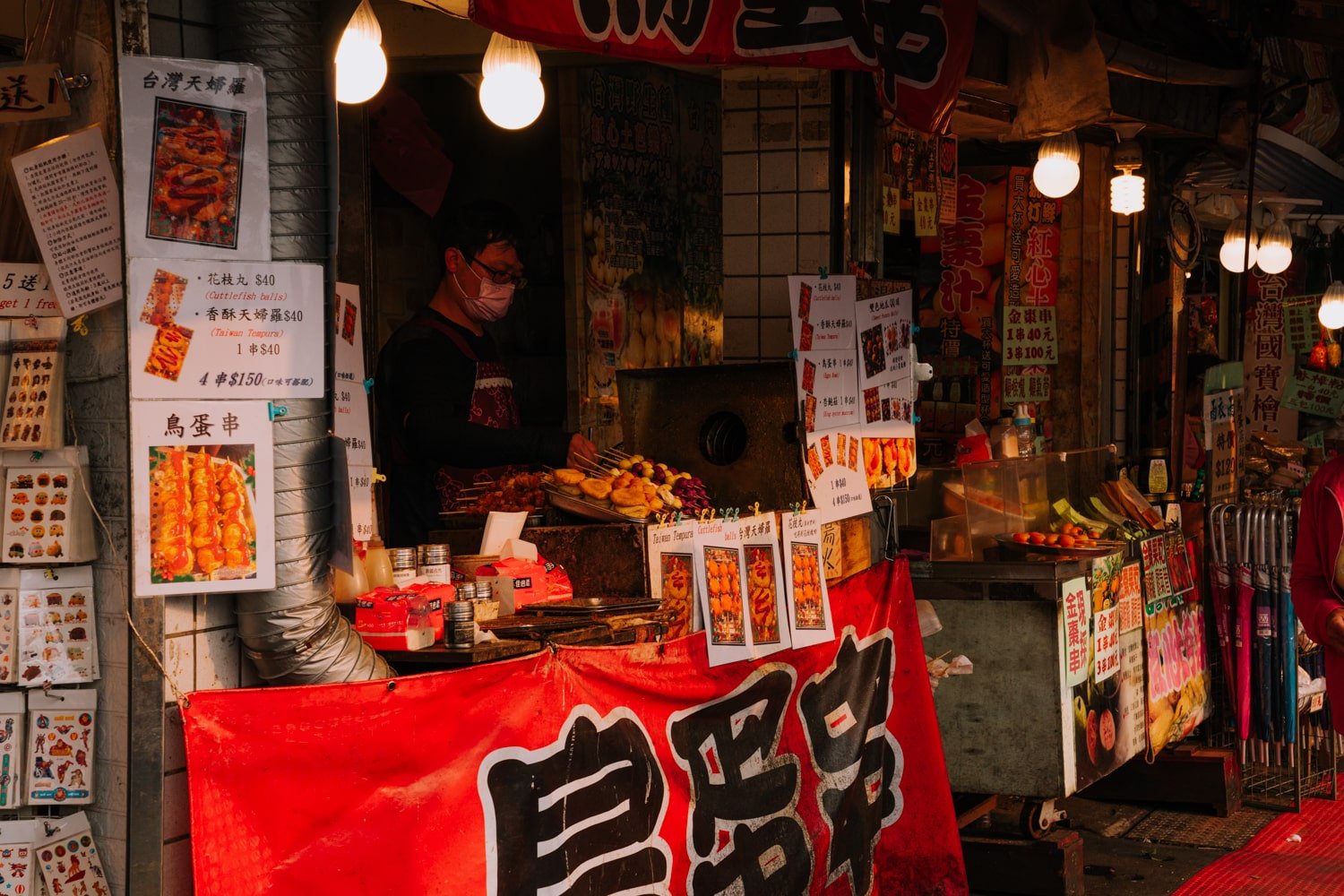 Streed food vendor making Taiwanese tempura street food in Jiufen Old Street, Taiwan.