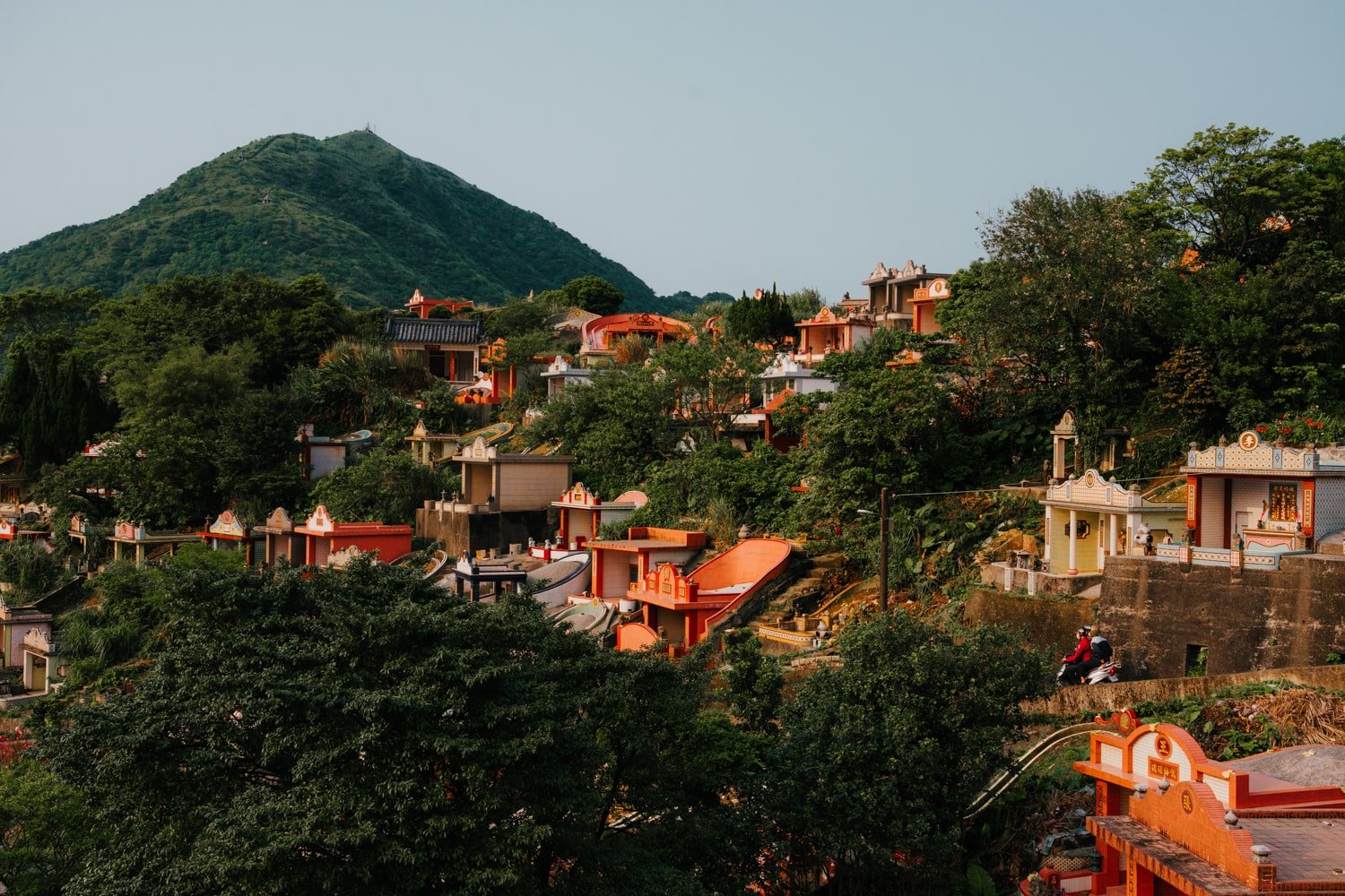 Colorful cemetery with Mount Keelung in background in the mountain town of Jiufen, Northern Taiwan.