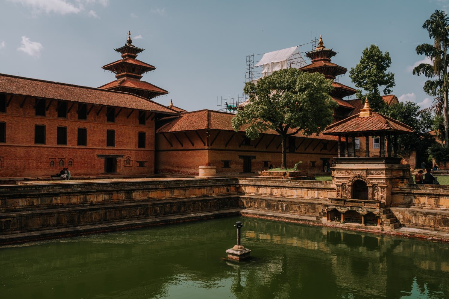 The former royal bath (Bhandarkal) with the royal palace and Patan pagodas in the background.