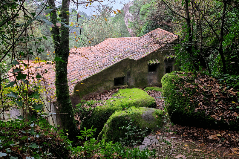 Convent of the Capuchos nestled in the forest of Sintra with mossy stones