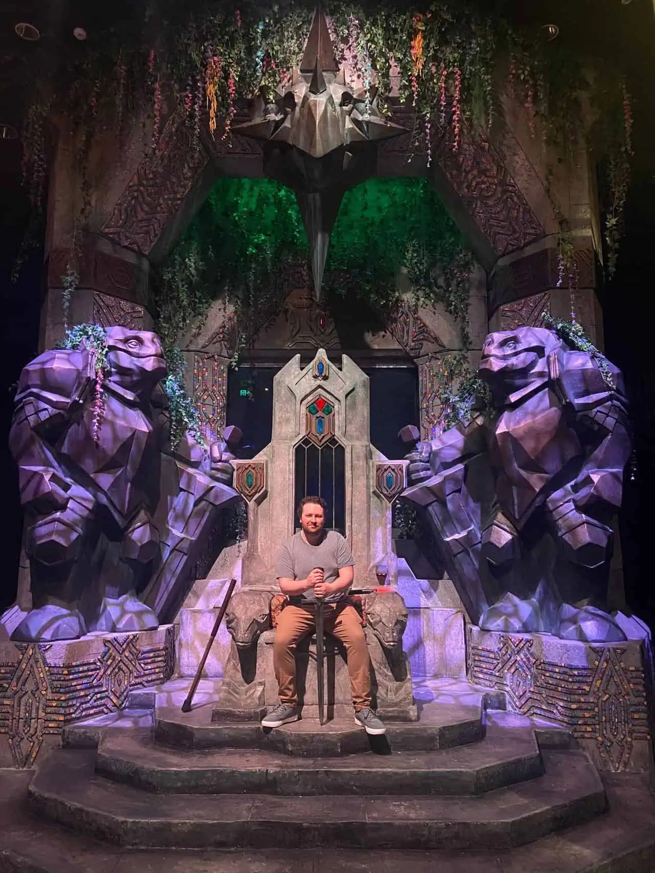 Colin Sitting on a throne at Weta Workshop Unlimited in Auckland