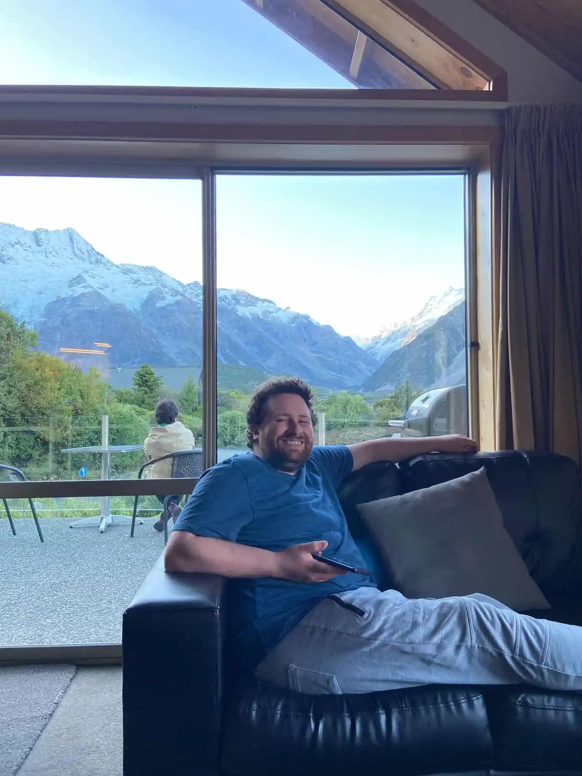 Colin enjoying the view at our budget Mt Cook hotel in Aoraki Mt Cook Village