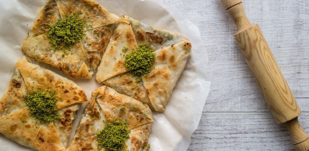 Turkish dessert Katmer with rolling pin on the side. 