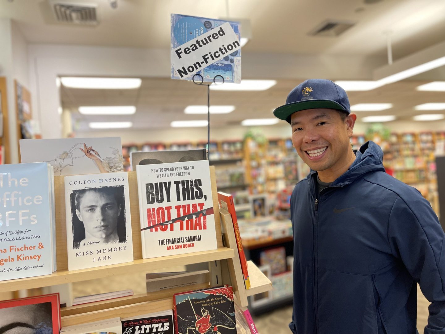 Photo of Sam Dogen in a bookstore with the book he wrote