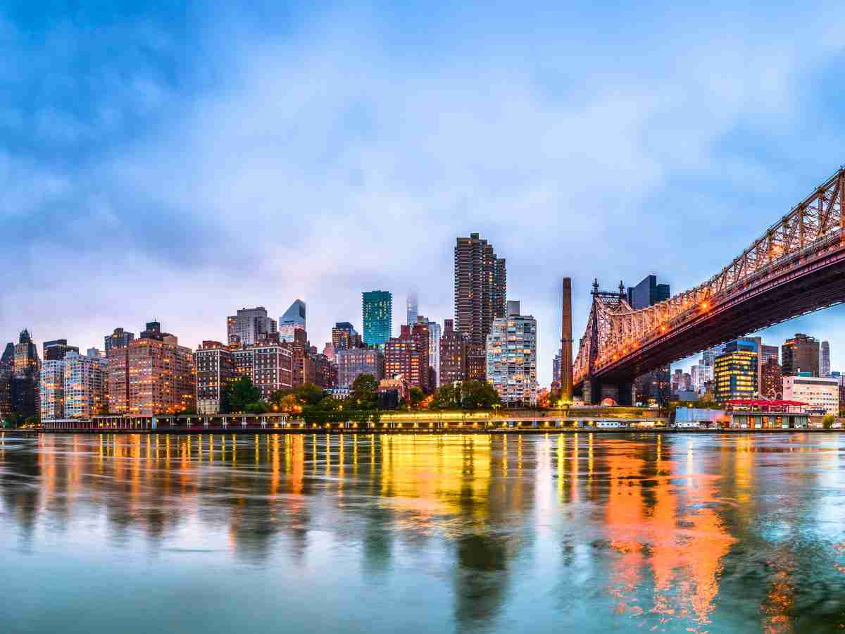 Skyline of Manhattan from across the East River New York: Amtrak routes from Chicago