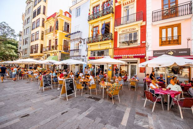 Spain offers one of the lowest costs of living in Western Europe. And the outdoor cafe scene in Valencia certainly has appeal.(RossHelen/iStock Editorial/Getty Images)