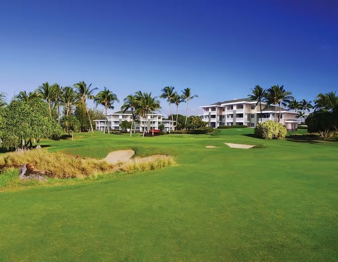 View of the putting green and golf course at Kings' Land. 