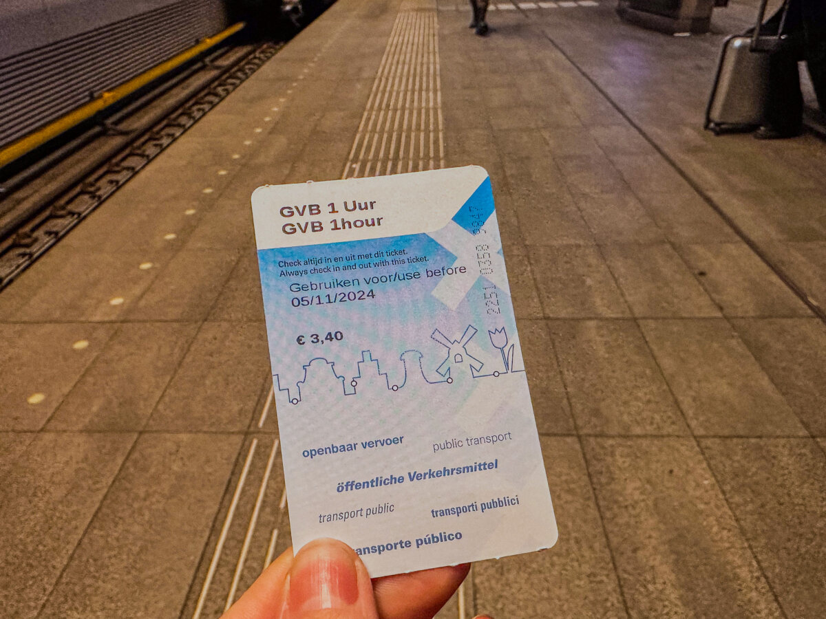 Person Holding 1 Hour GVB Pass for getting around Amsterdam Transportation