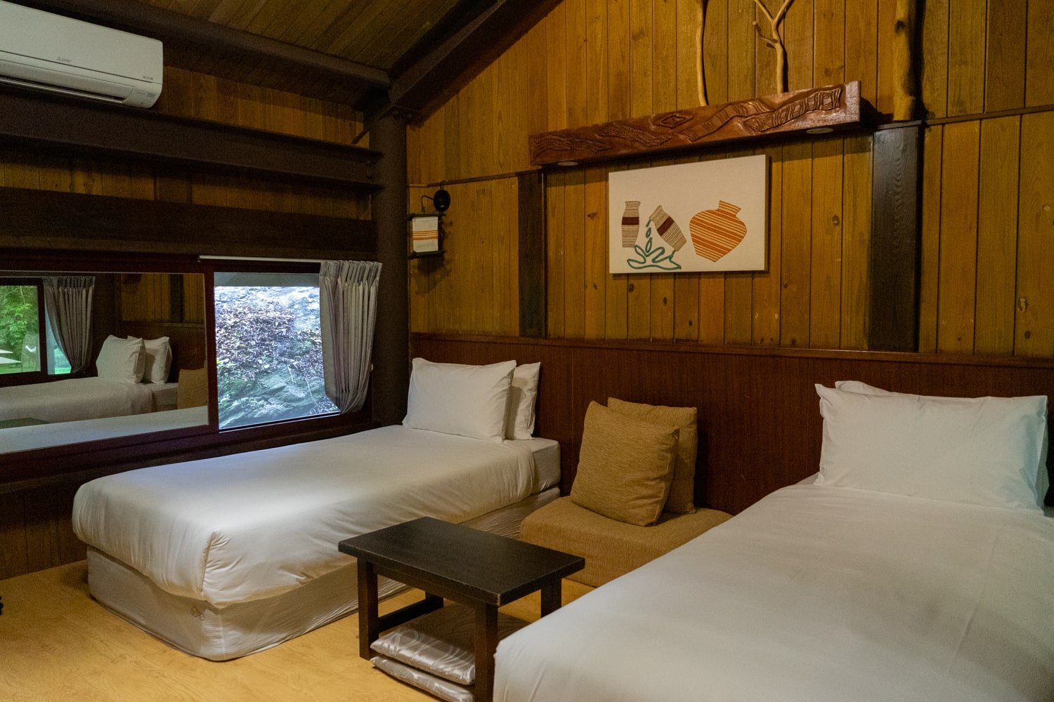 Two twin beds inside a cabin lodge of the Taroko Village Hotel in Taroko Gorge, Taiwan.