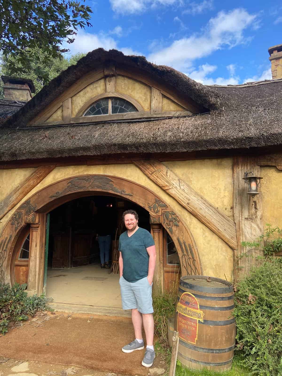 Colin in front of the Green Dragon, Hobbiton