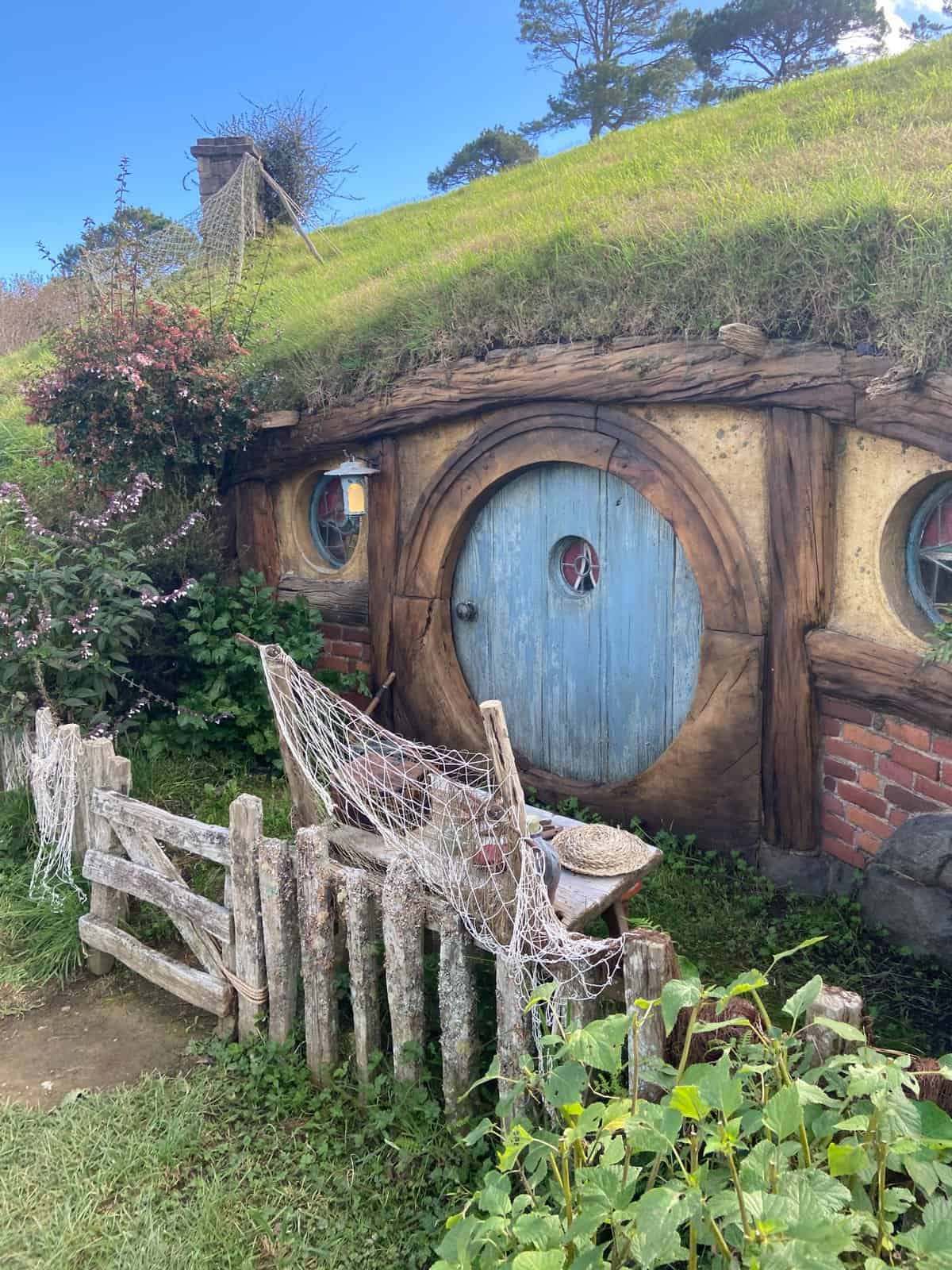 Hobbit Hole with blue door in Hobbiton, New Zealand