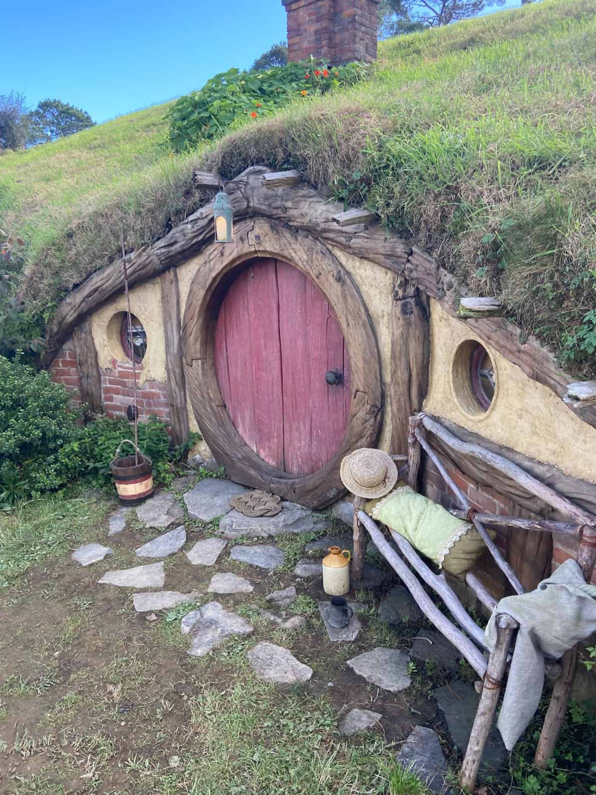 Hobbit Hole with red door in Hobbiton, New Zealand