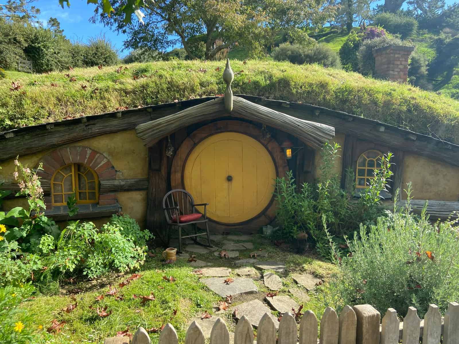 Hobbit Hole with yellow door on the set tour of Hobbiton, New Zealand