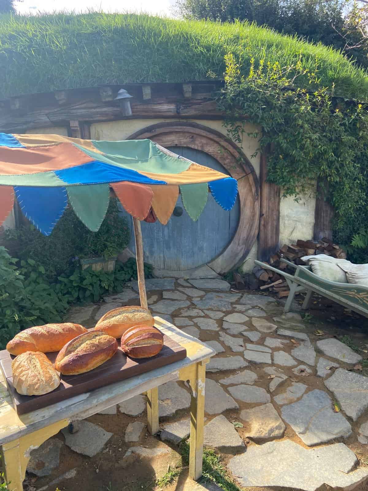 Hobbit Hole belonging to the baker with bread outside, Hobbiton New Zealand