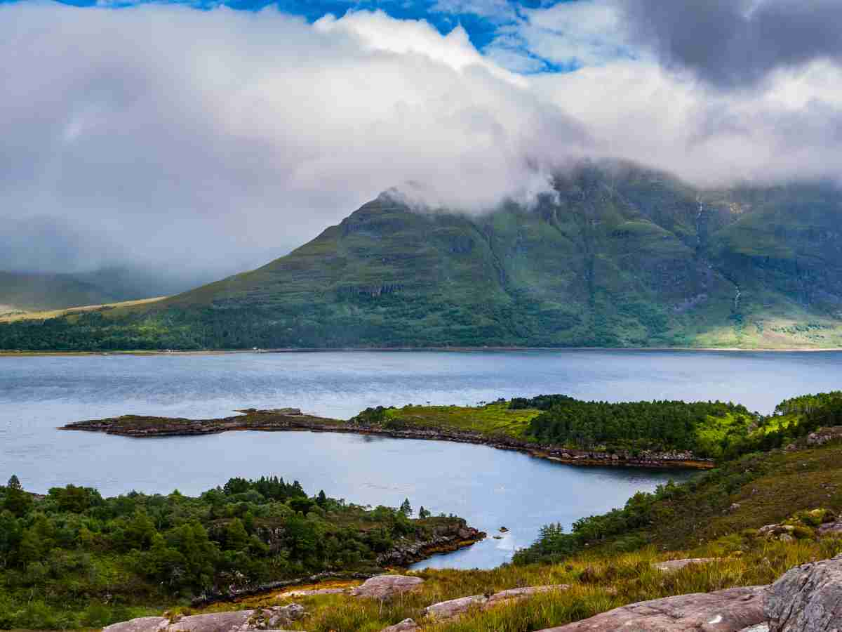 view of Loch Torridon with mountains shrouded in misty clouds