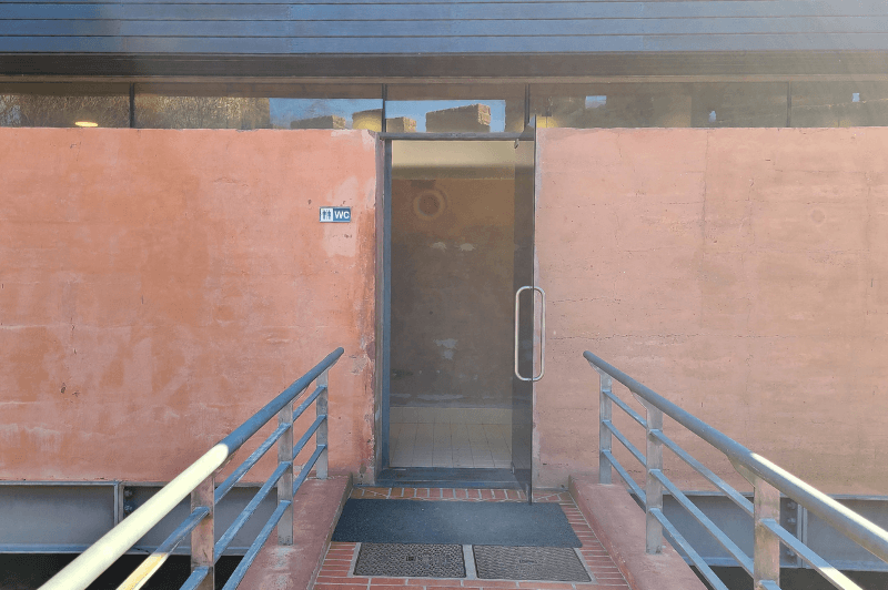 Ramp leading to a building labelled WC