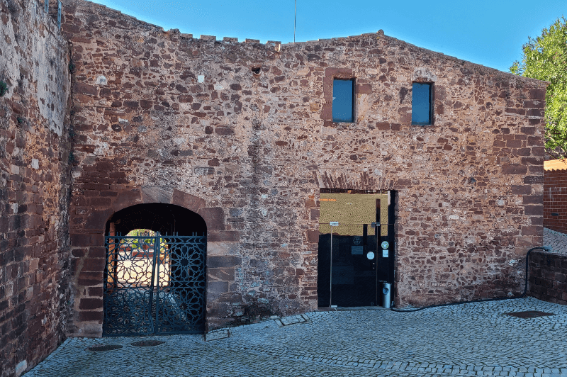 The red brick castle entrance in Silves where the ticket office is.