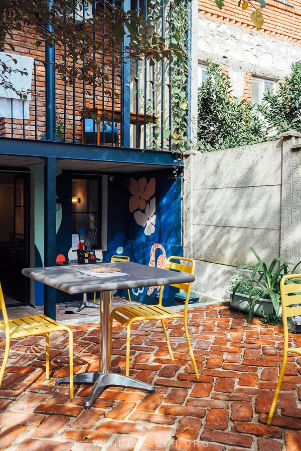 Tables in a courtyard at Black Tomato Kitchen in Kutaisi.