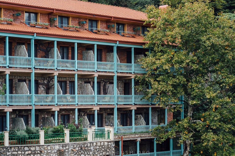 A blue balcony on a Kutaisi hotel overlooking the Rioni river.