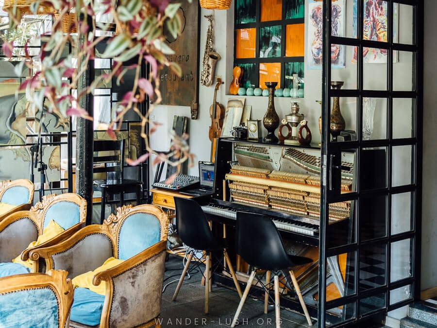 Retro fittings and musical instruments inside Papavero restaurant in Kutaisi.