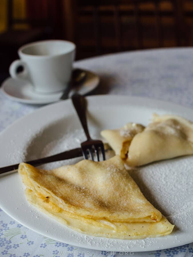 A thin crepe and a cup of coffee at a cafe in Kutaisi Georgia.