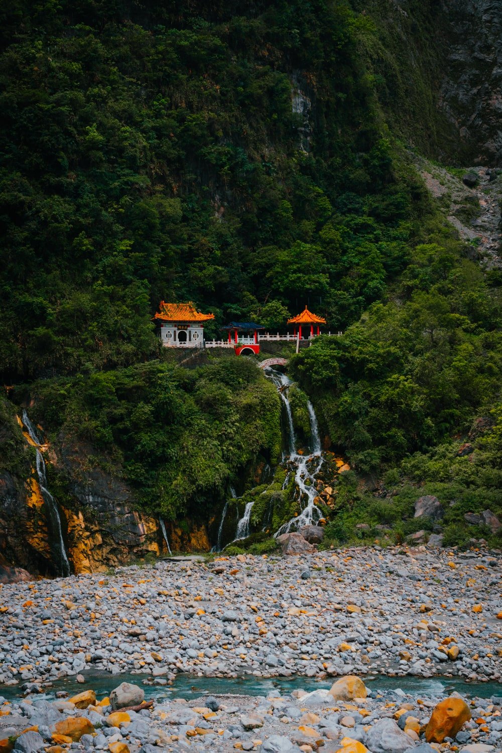 The Eternal Spring Shrine with waterfall tumbling down into the riverbed—a popular place to see in Taroko Gorge, Taiwan.