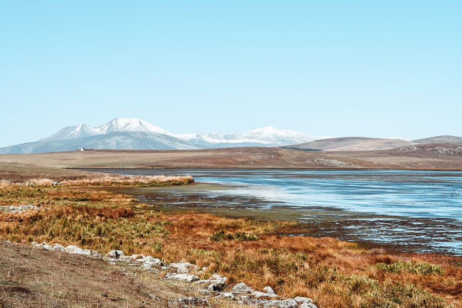 A lake and volcanic mountains in Georgia's Javakheti Protected Areas.