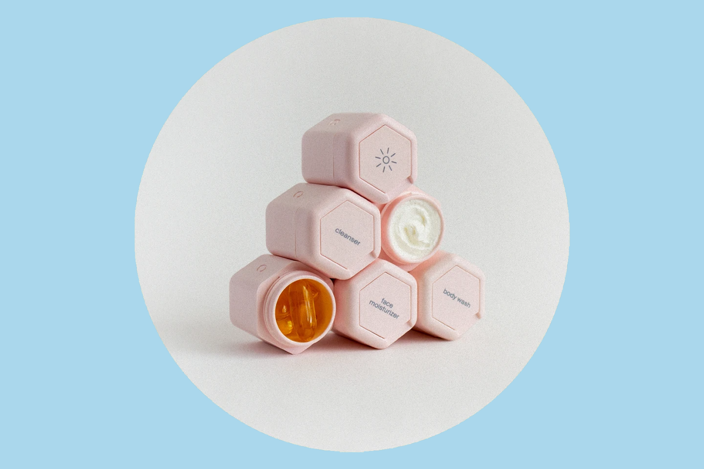 Pyramid of six small hexagonal pink capsules magnetically attached to each other