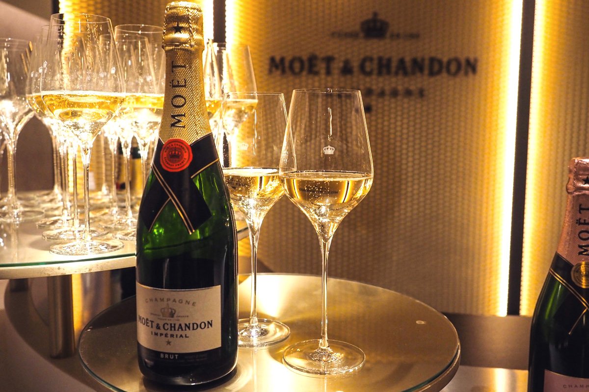 Two glasses of champagne next to a bottle at the Mote et Chandon tasting in Epernay. 