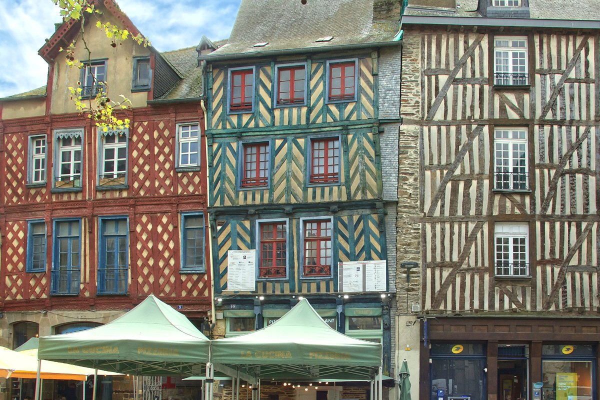 A row of colorful half-timbered houses in the Rennes city center.