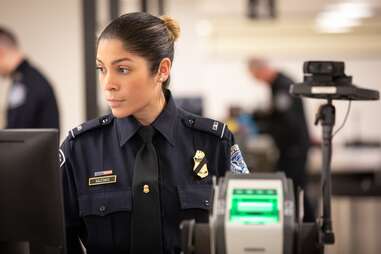 female officer at border control