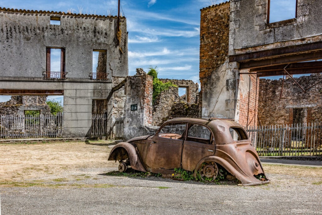 Oradour-Sur-Glane ruins and a burnt out car