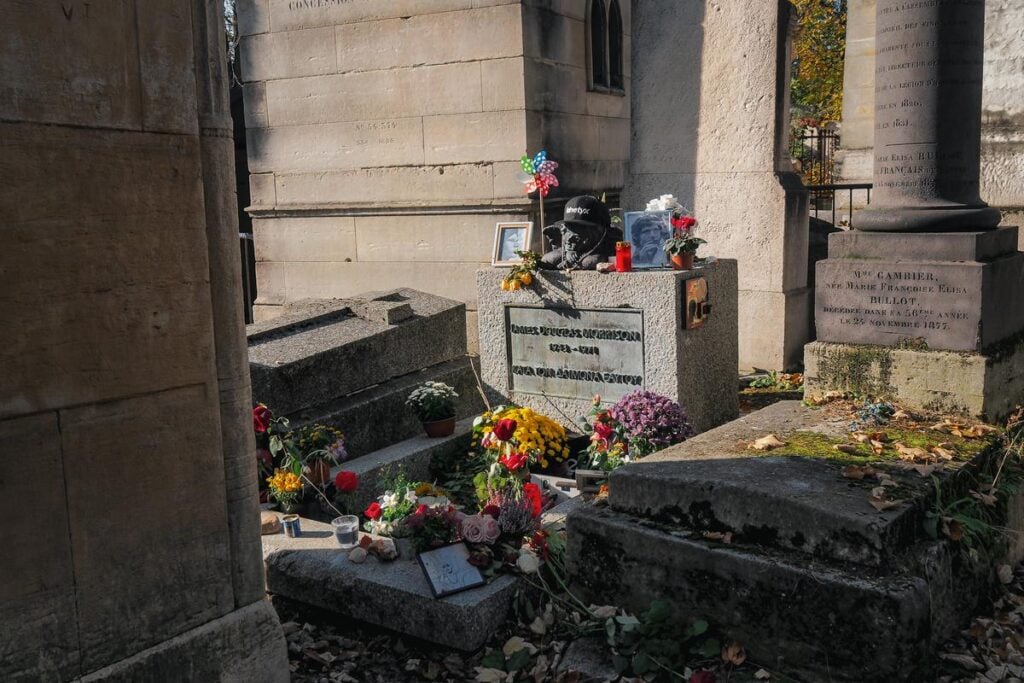 Jim Morrison's grave adorned with tributes at Père-Lachaise Cemetery
