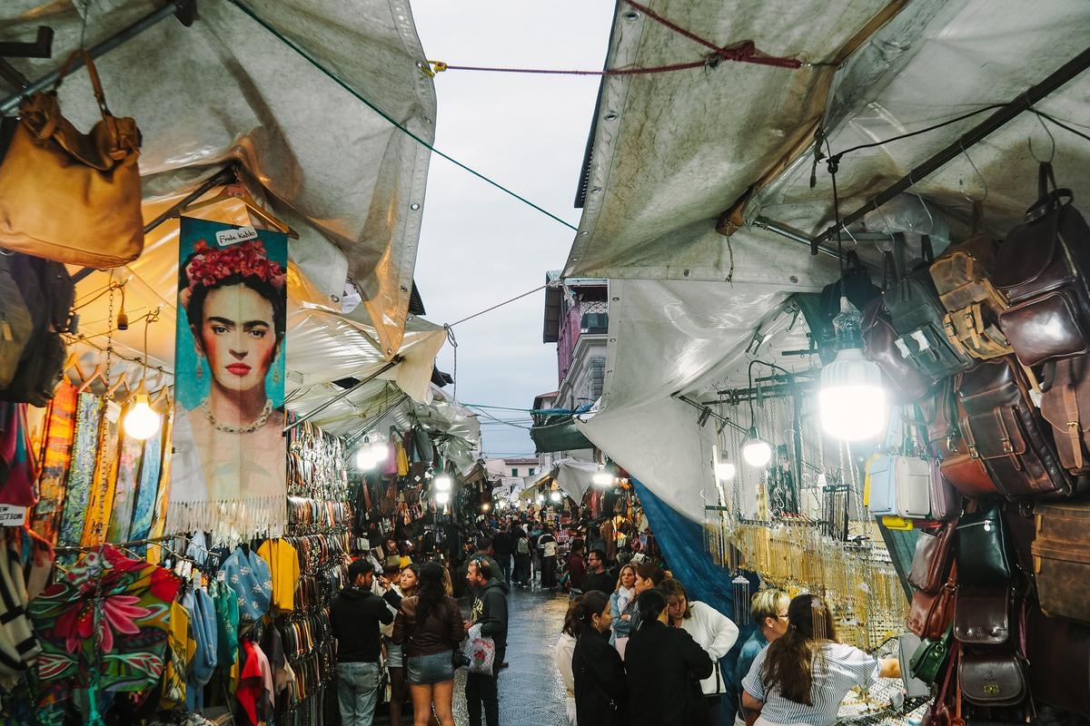 Bustling San Lorenzo Market in Florence with diverse stalls and vibrant atmosphere