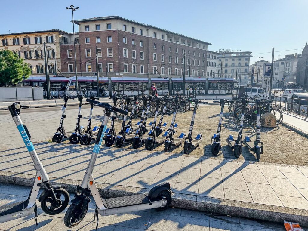 Bird electric scooters lined up for rent at Santa Maria Novella Station in Florence.